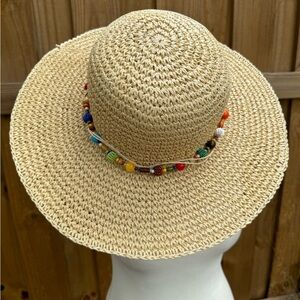 Cappelli New York cream straw hat with colorful beaded band.Like new condition.